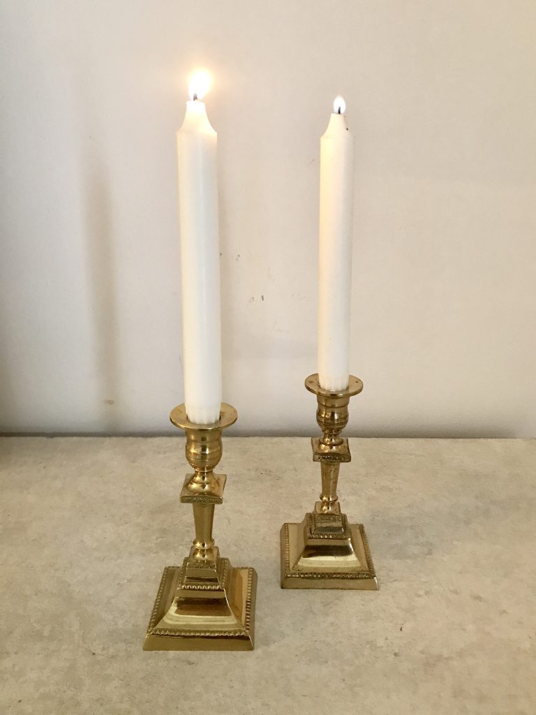 A pair of brass candlesticks DD-113